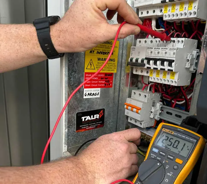 Inspecting a tripped MCB and burnt fuse terminal inside a Dubai apartment consumer unit